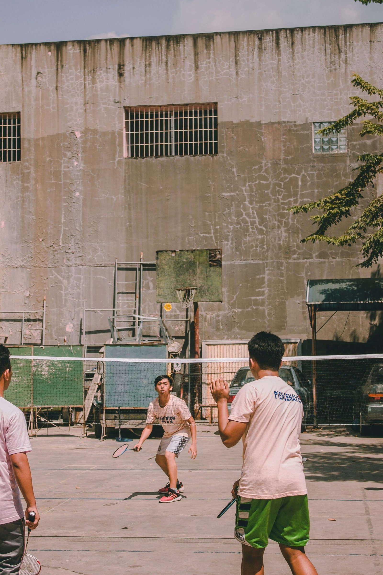 Photo of Boys Playing Badminton. jenniferanistonbody.com